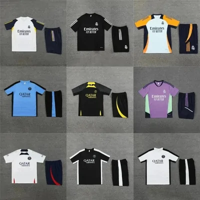Nine football kits on a grey backdrop, shirts with matching shorts