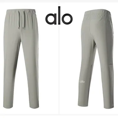 Two pairs of grey track pants photographed front and back