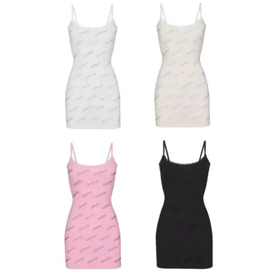 Four strappy mini dresses laid flat: two white, one pink, one black